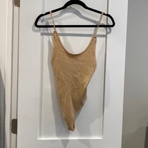 Tan body suit